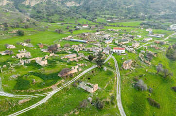 Rural depopulation in Cyprus. Abandoned village Souskiou in Paphos district, aerial landscape - obrazy, fototapety, plakaty