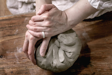 Pottery clay in femail hands