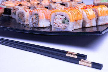 Japanese cuisine. Sushi set of nigiri and maki rolls served. Top view