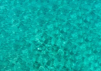 Fototapeta premium abstraction, ripples on turquoise water background, space for text