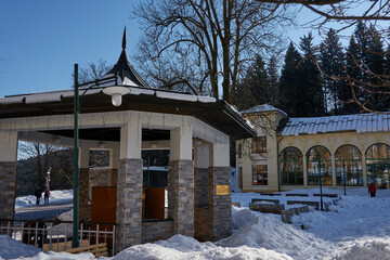 Janske Lazne, Czech Republic - February 13, 2022 - The park in front of the colonnade on a sunny winter day  