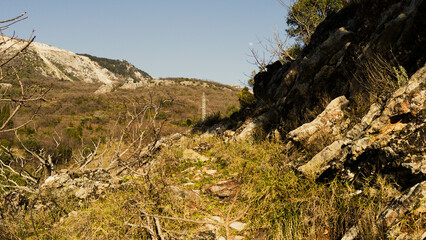 Mountain landscape. A path high in the mountains. Stone path. Goat trail through the mountains