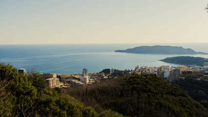 Mountain landscape with a view of the sea riviera and the coastal city. The photo was taken high in the mountains