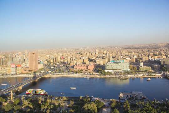 CAIRO, EGYPT - DECEMBER 29, 2021: Beautiful view of the center of Cairo and Zamalek island from the Cairo Tower in Cairo, Egypt © marinadatsenko