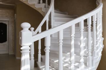 new, elegant, white stairs and handrails made of natural wood, handmade