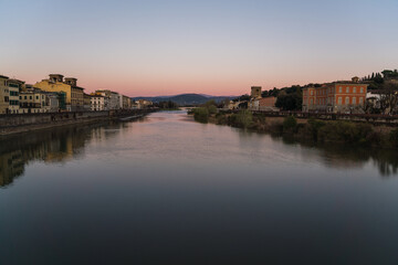sunset over the Arno river in Florence, Italy 