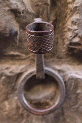 Metal Iron Horse Hitching Post against old stone walls Florence Italy 
