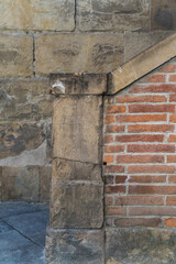 detail of an old medieval staircase and brick wall in Florence, Italy 