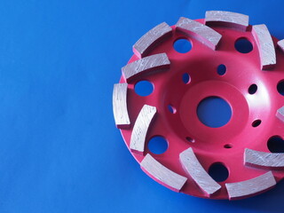 Diamond cup wheel on blue background. Segmented double row diamond cup wheel