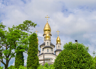Christian church cross in high steeple tower for prayer