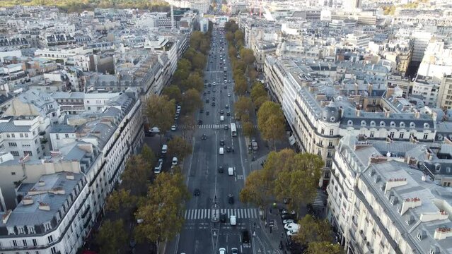 A drone view of the residential quarters in Paris separated by a wide avenue.
