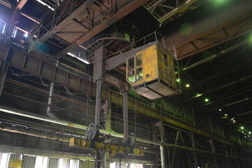 The cabin of the bridge crane in the shop of the metallurgical plant