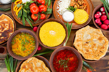 Homemade Romanian Food with 
pies, polenta, borscht, vegetables, fish, meat, stew, cheese and wine. Traditional dishes from Romania and the Republic of Moldova.