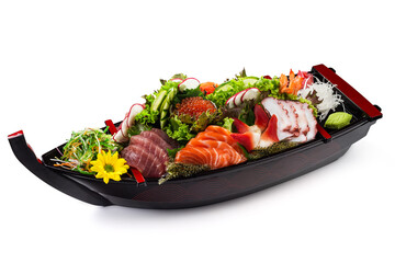 Combo Sushi sashimi: salmon, tuna, shrimp, nishin octopus, red caviar with vegetables in a wooden...