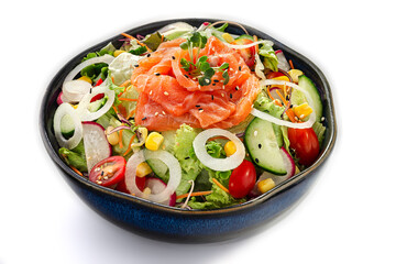 Fresh salmon sashimi salad with cherry tomatoes, cucumbers and lettuce greens isolated on a white background