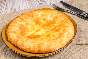 khachapuri with cheese, imeretian khachapuri, georgian cuisine on wooden table