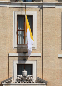 Vatican City, VA, Vatican - August 16, 2020: National flag and the sculpture symbol of Saint Peter with keys