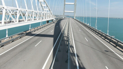 Naklejka premium Aerial view of Empty Istanbul Bosphorus Bridge. Action. Aerial view of white new bridge above breathtaking blue water.