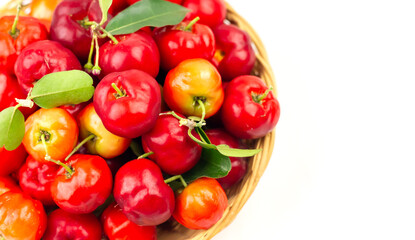 Acerola Cherry or Barbados Cherry on basket isolated on white background.