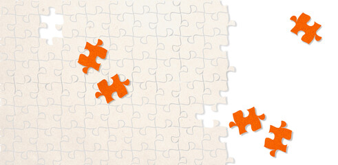 Orange puzzle piece on a background with missing puzzle pieces with copy space isolated on white background for motivation and consultation concept