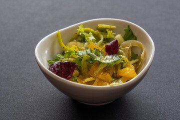Vegetable salad in a white bowl. Spring vitamins.