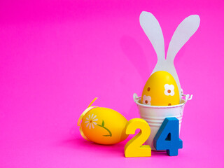 Easter minimalistic interior decor. with white bunny ears on a pink background. bright Easter holiday on April 24, free space