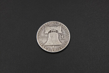 Vintage half dollar coin on black background