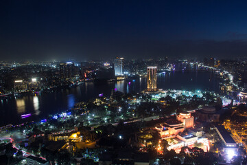 CAIRO, EGYPT - DECEMBER 29, 2021: Beautiful view of the center of Cairo and Zamalek island from the Cairo Tower in Cairo, Egypt © marinadatsenko