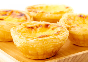 Egg tart on wooden plate