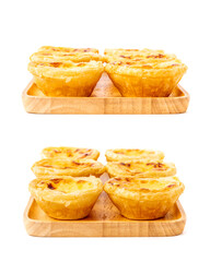 Egg tart on wooden plate isolated on white background