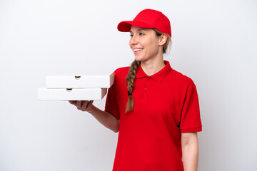 pizza delivery woman with work uniform picking up pizza boxes isolated on white background looking...