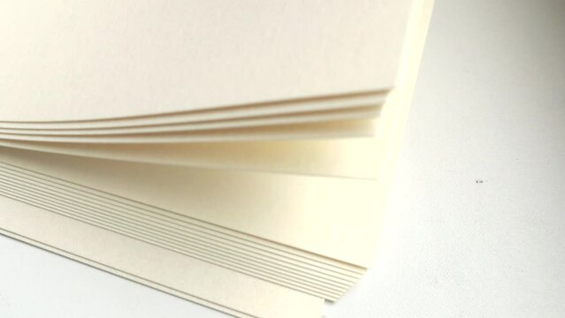 4k video, close-up of a stack of paper, blank white sheets flipping and counting