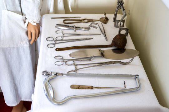 A set of old surgical medical instruments in a hospital operating room.
