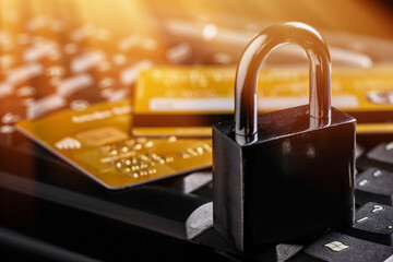 Security lock on credit cards with computer keyboard - credit card data security