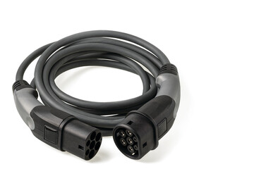 Obraz premium Close up view of black electric vehicle charging cable for outdoor use with 3-phase 20A 480V plug isolated on white background. Sweden.
