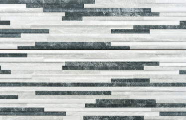 Porcelain tile with black, white and gray stripes.