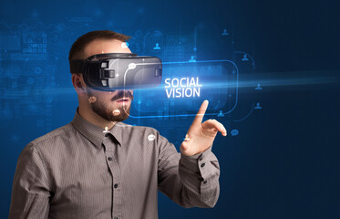 Businessman looking through Virtual Reality glasses, social media concept