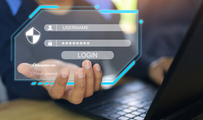 A man holding a virtual screen in his hand indicates a login to enter a cyber computer system or cybersecurity in accordance with ISO 27001 and 27002.