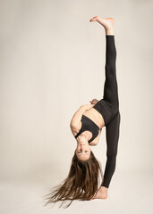 woman doing yoga EXERCISES STANDING TALL AND DANCER FLEXIBLE