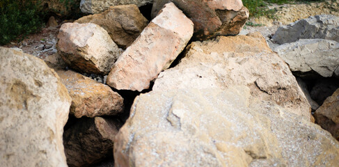 Stone backgrounds. Cobblestone. Boulders. Breakwaters. Large stones on the coast.