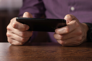 Touch screen smartphone, in hand. close up