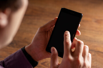 Touch screen smartphone, in hand. close up