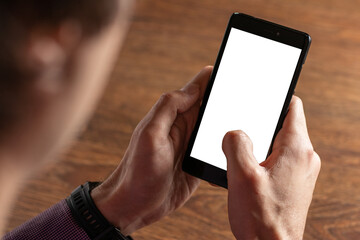 Man using smartphone. Blank screen mobile phone for graphic display montage.