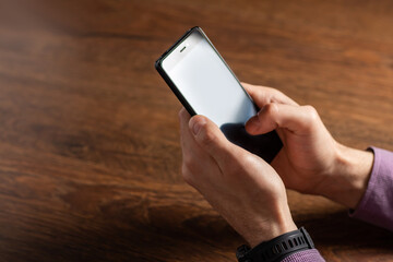 Touch screen smartphone, in hand. close up