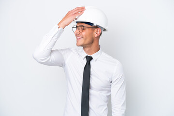 Young architect caucasian man with helmet and holding blueprints isolated on white background has realized something and intending the solution