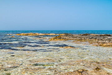 Rocky seashore in Cyprus. Seashore on Mediterranean sea.