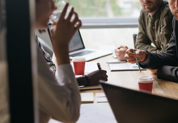 group of business people sitting in a meeting room of a coworkin