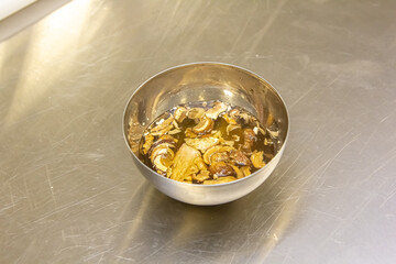 Dried porcini mushrooms are soaked in water for cooking