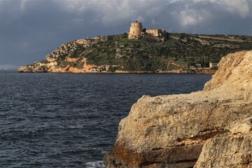 Fototapeta na wymiar Bay of Calamosca and the Lighthouse of Sant'Elia. Cagliari, Sardinia, Italy