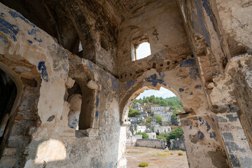 Fototapeta premium Kayaköy Abandoned ghost town, stone houses and ruins. The site of the 18th-century Ancient Greek city of Karmilissos. Ancient church. Fethiye - TURKEY